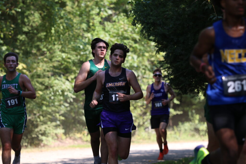 Charles Reeg running ahead of several runners