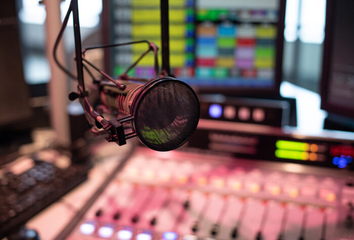 a microphone hovers over a sound board