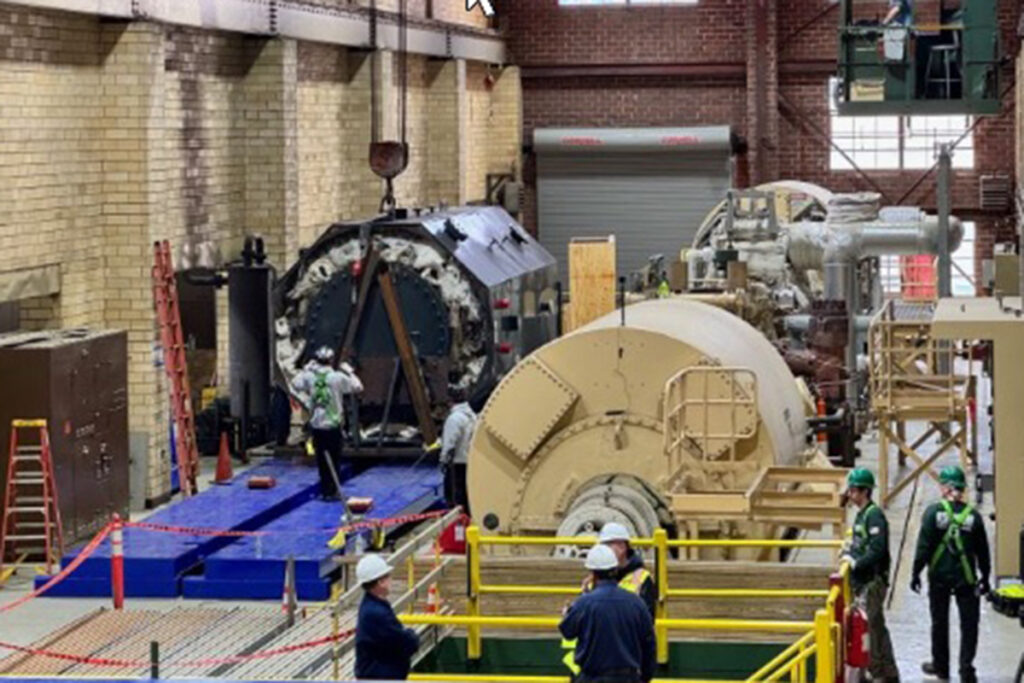 machinery in a brick-walled steam plant