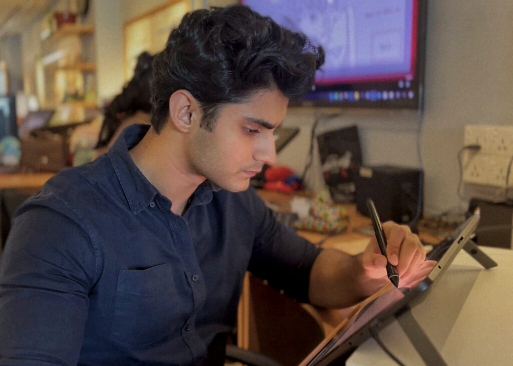 Sarim Kidwai at a drawing table