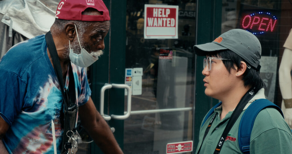 Kai Luo with Hal the newspaper vendor