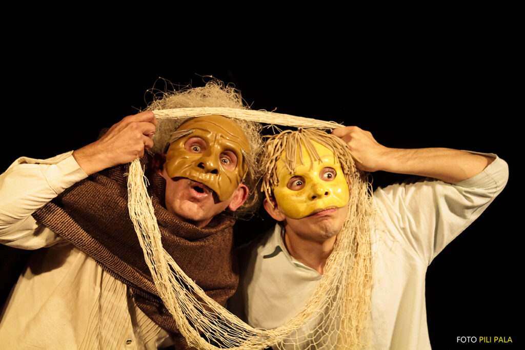 two people wearing masks look through a net