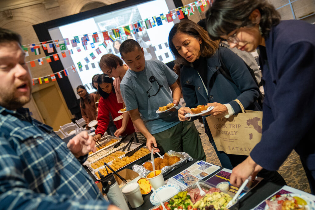 People in line getting food from a buffet