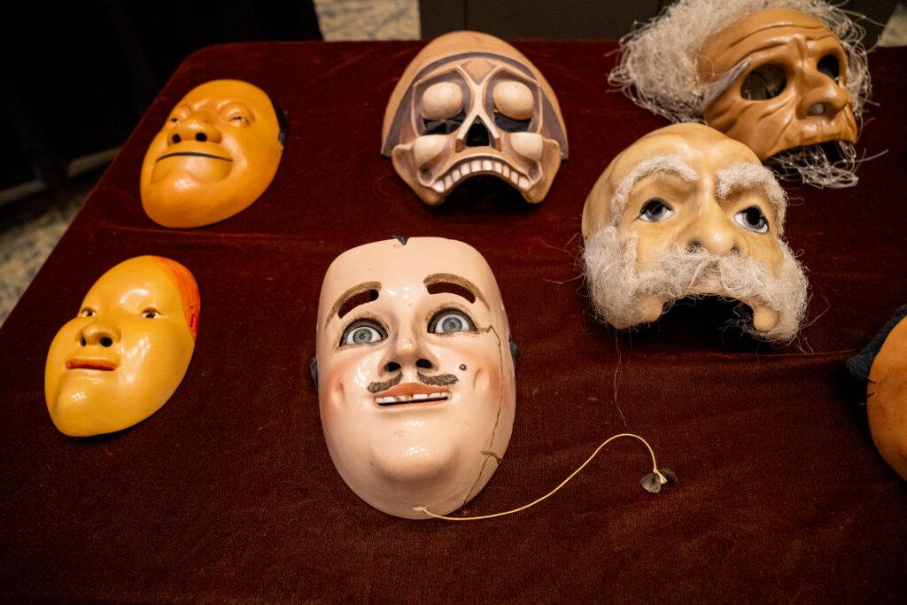 Several handmade masks on a table