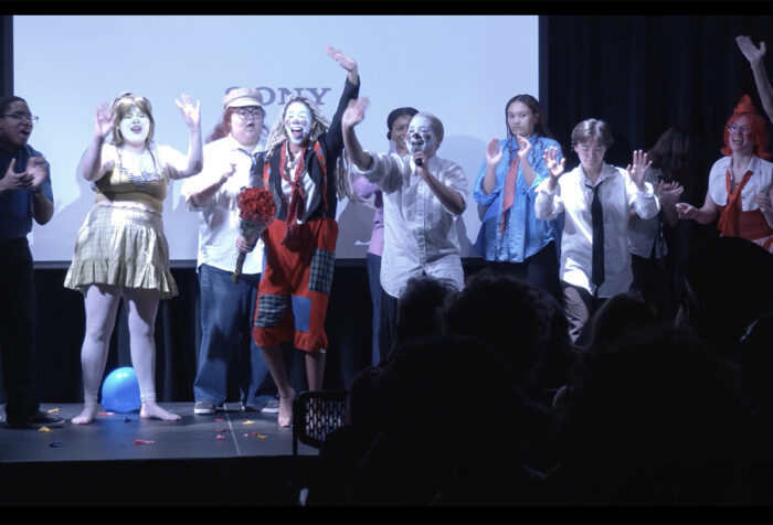 Comics of Color on stage perform as clowns