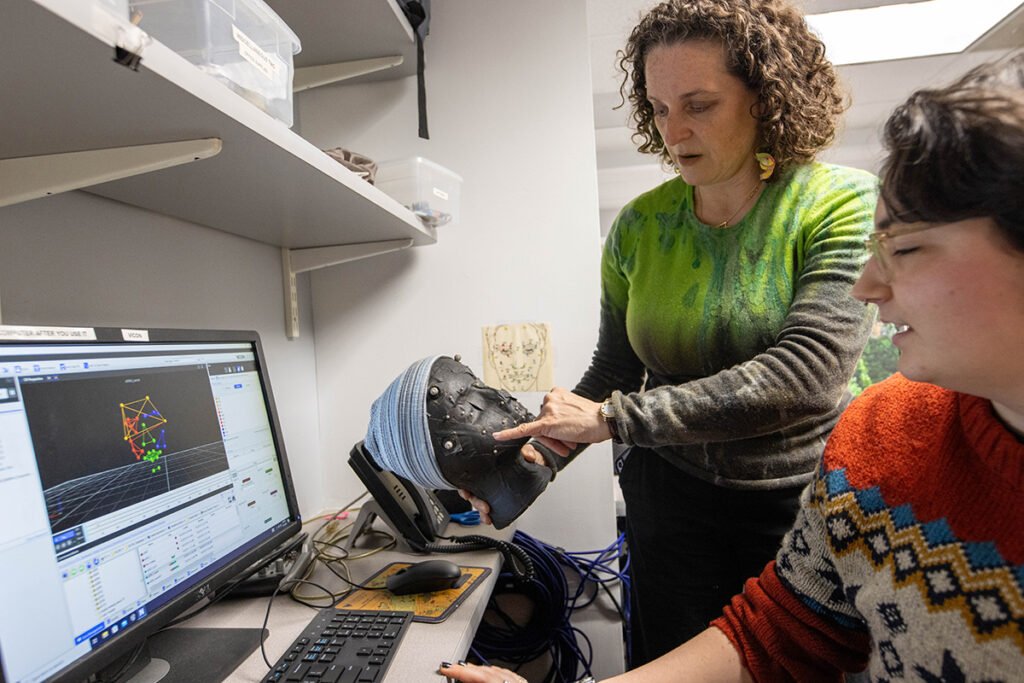 Ruth Grossman demonstrates to Cai Conners
