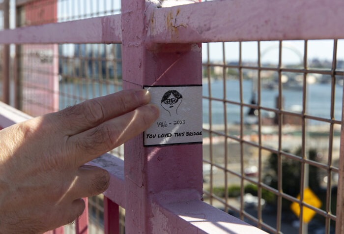 A sticker on a bridge that says: You loved this bridge