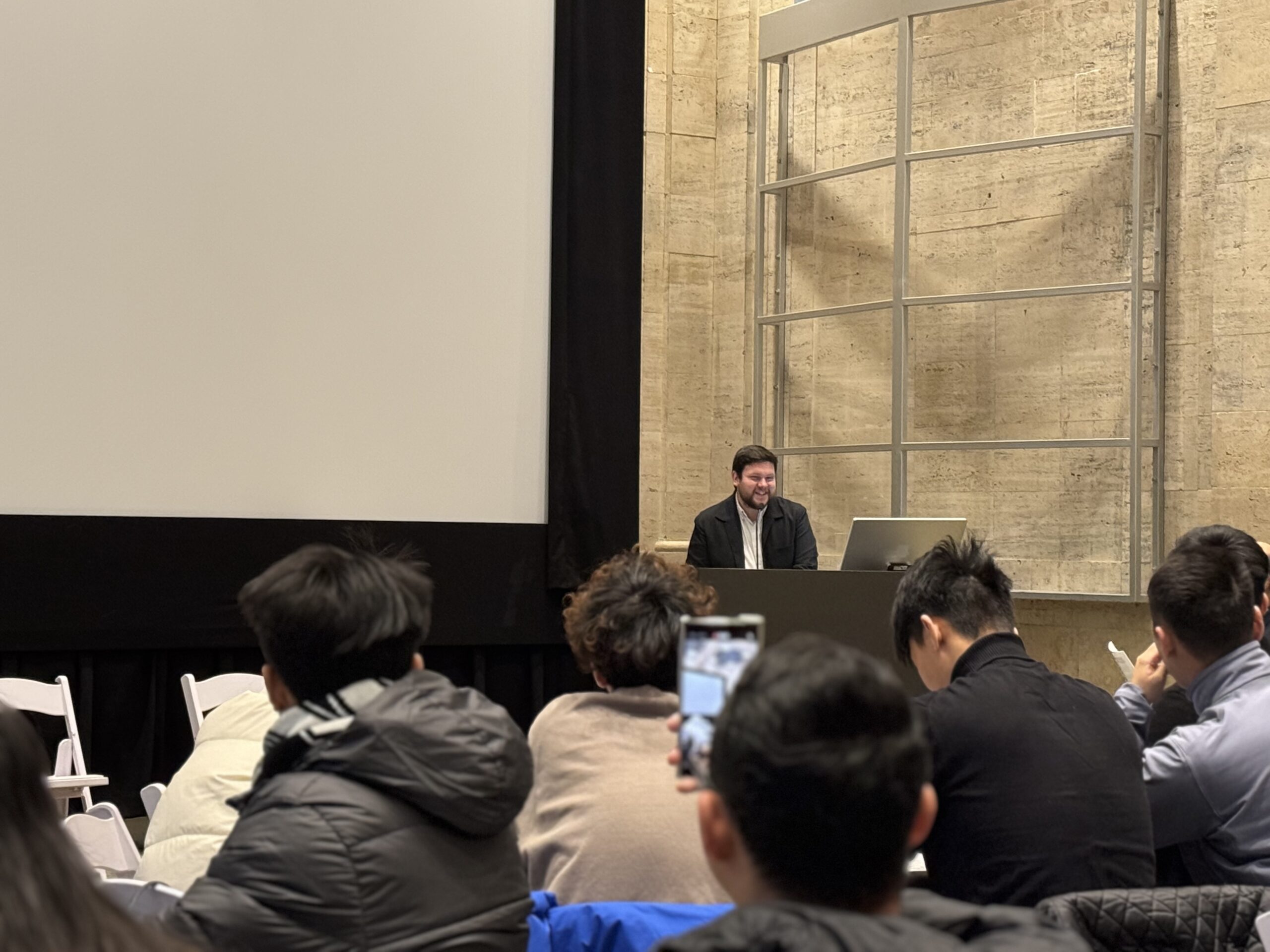 From behind a podium in Bordy, Corey Blackmar, Director of Global Partnerships & Internationalization, welcomes UIC participants and highlights the significance of cultural exchange. [Photo/Molly Loughman]