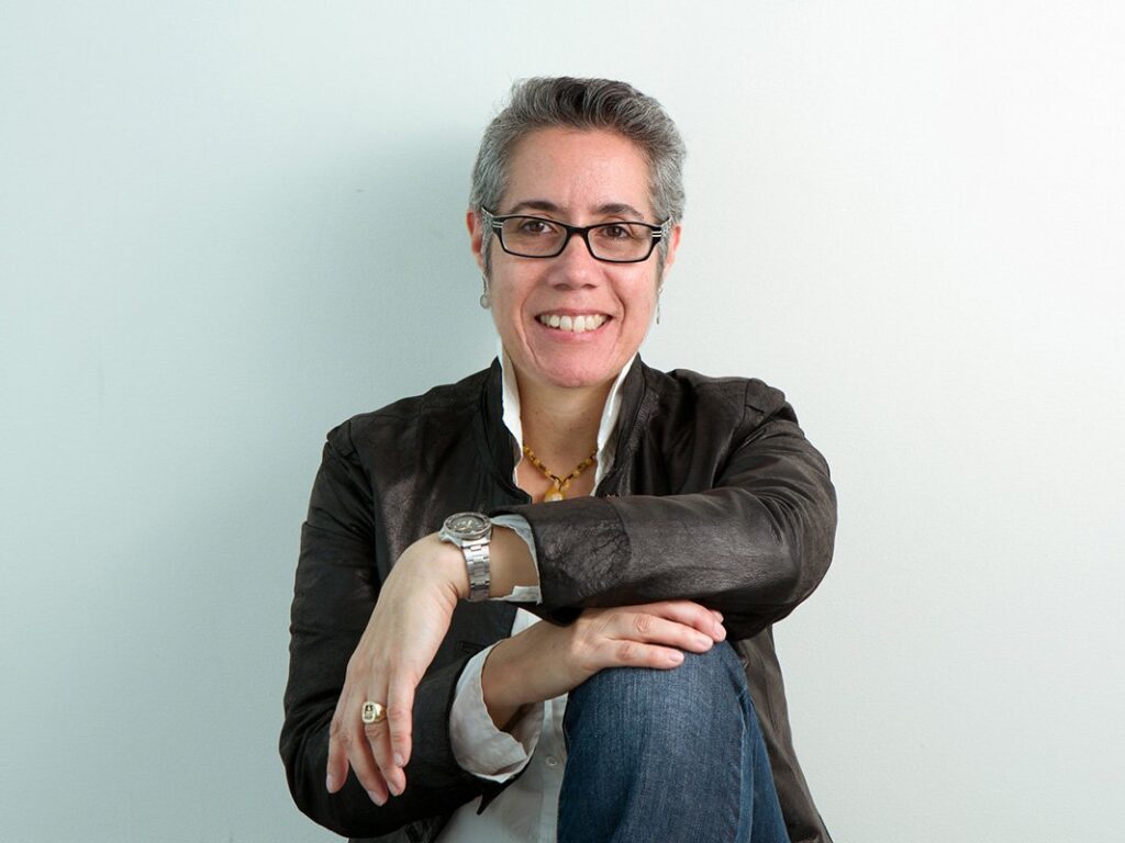 Cristina Kotz Cornejo seated against wall