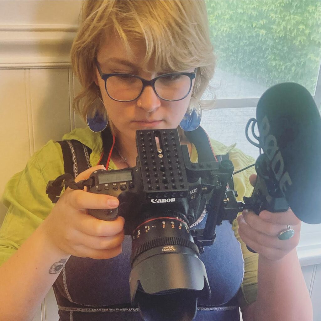 Sadie Sweitzer holds a camera