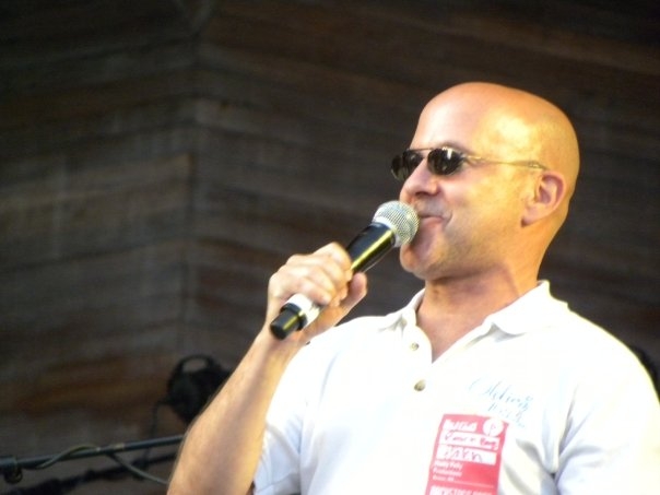 Barry Scott talks using a microphone