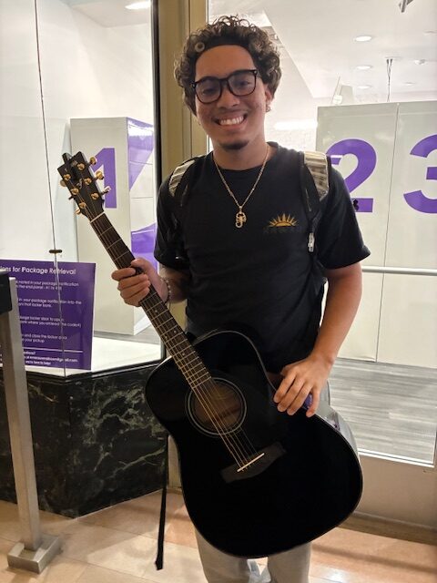 Kevin Reyes with his guitar.