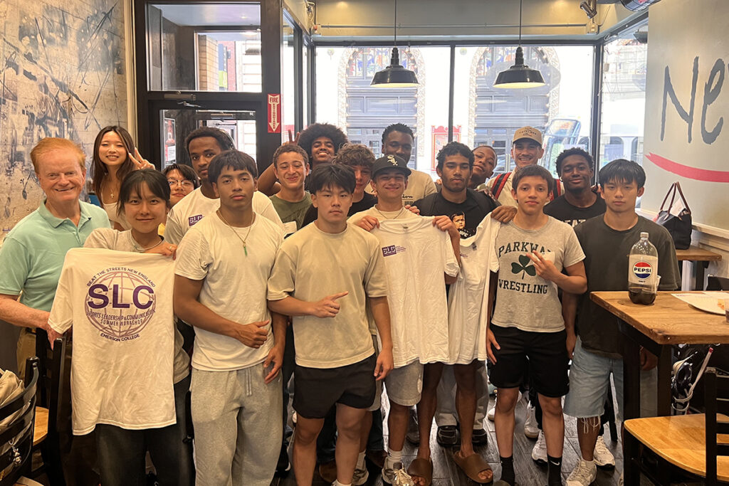 Group of teenagers and faculty inside local restaurant