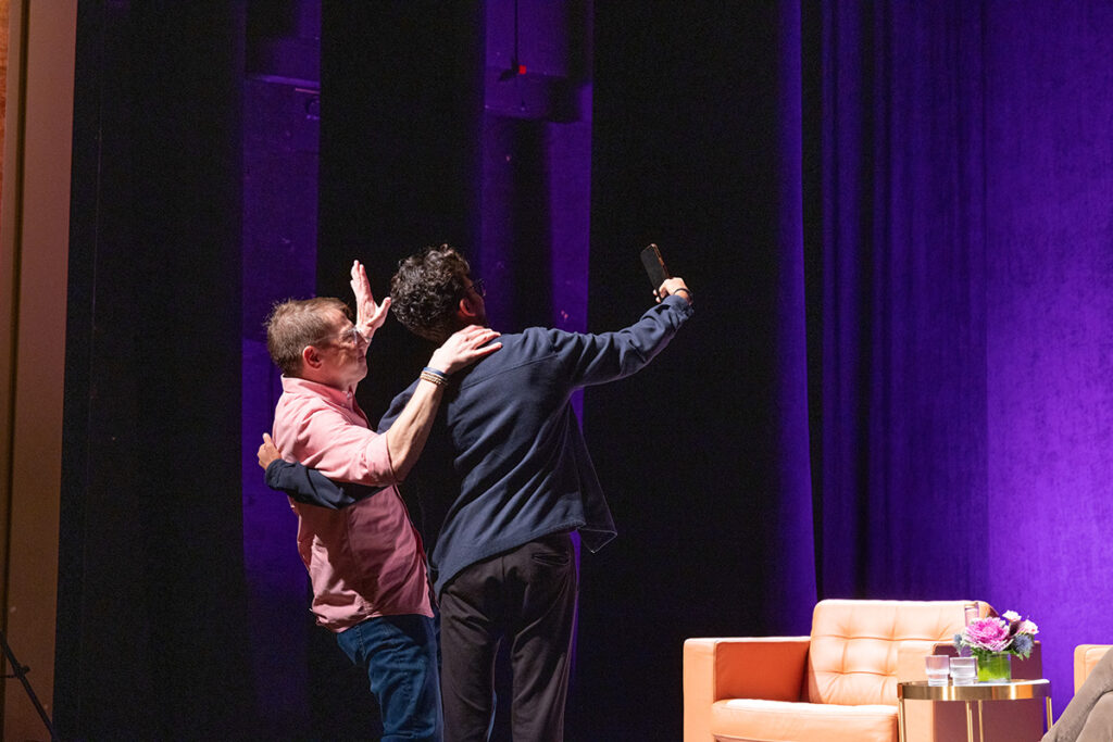 Man and student take selfie together