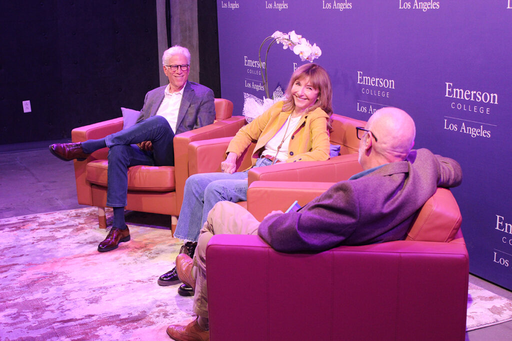 Actors Ted Danson and Mary Steenburgen talk to moderator in upholstered armchairs
