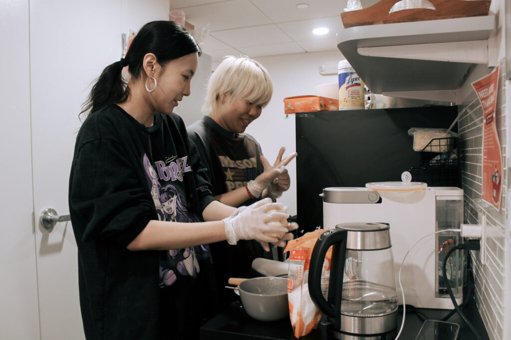 Two students make mooncakes