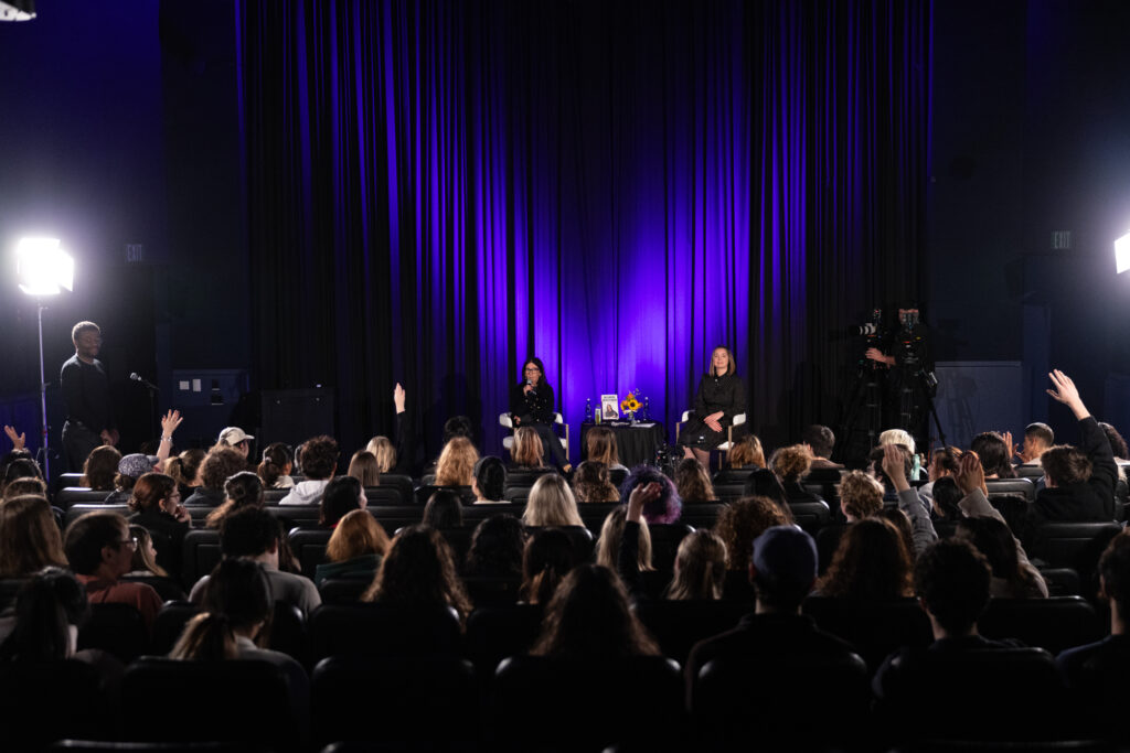 The audience looks at the stage