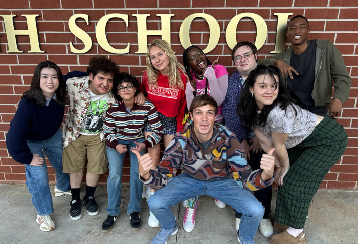 Cast members of English Teacher pose for a photo