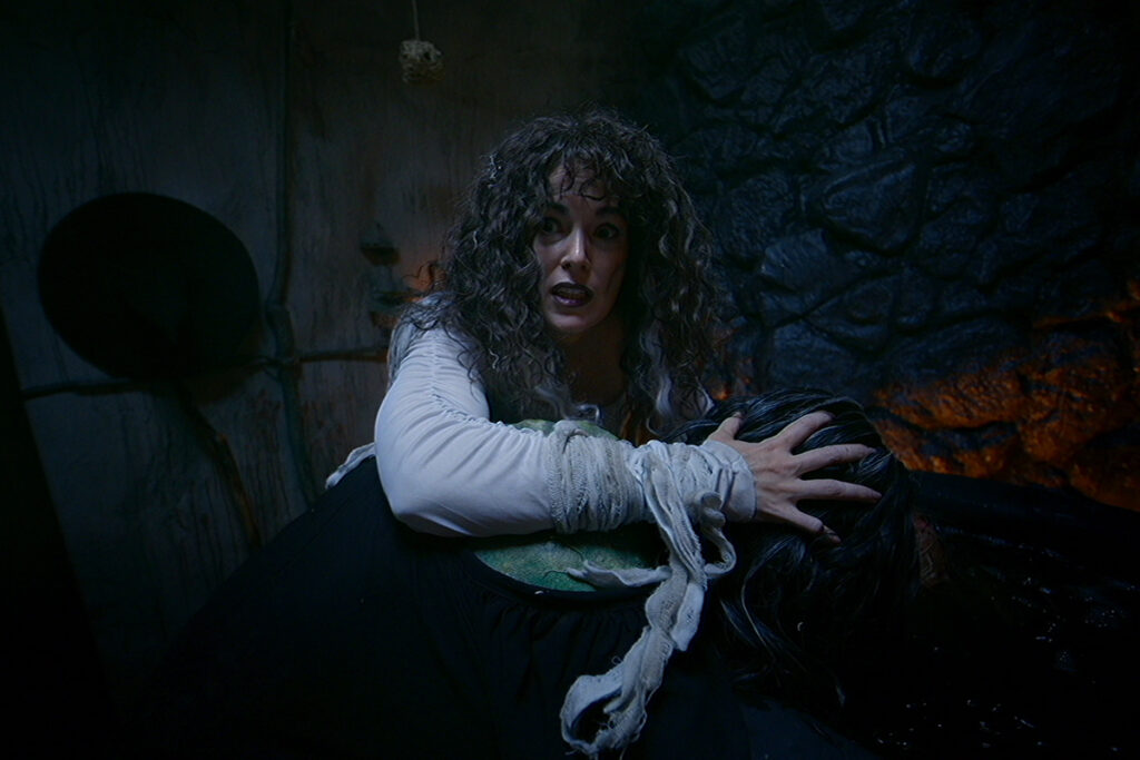 Sarah Nicklin looks scared while acting in horror movie V/H/S/ Halloween