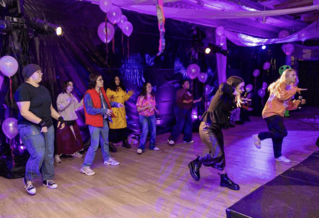 People dance on a stage