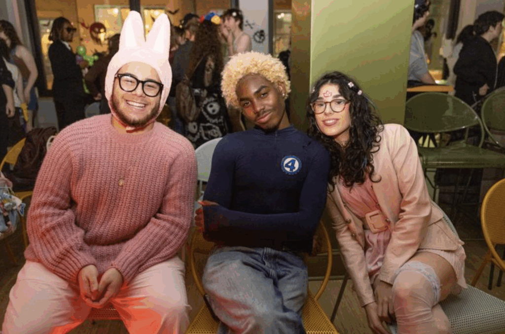 Three people pose for a photo