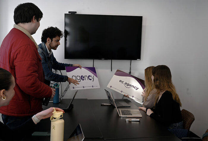 Several people sit around a table