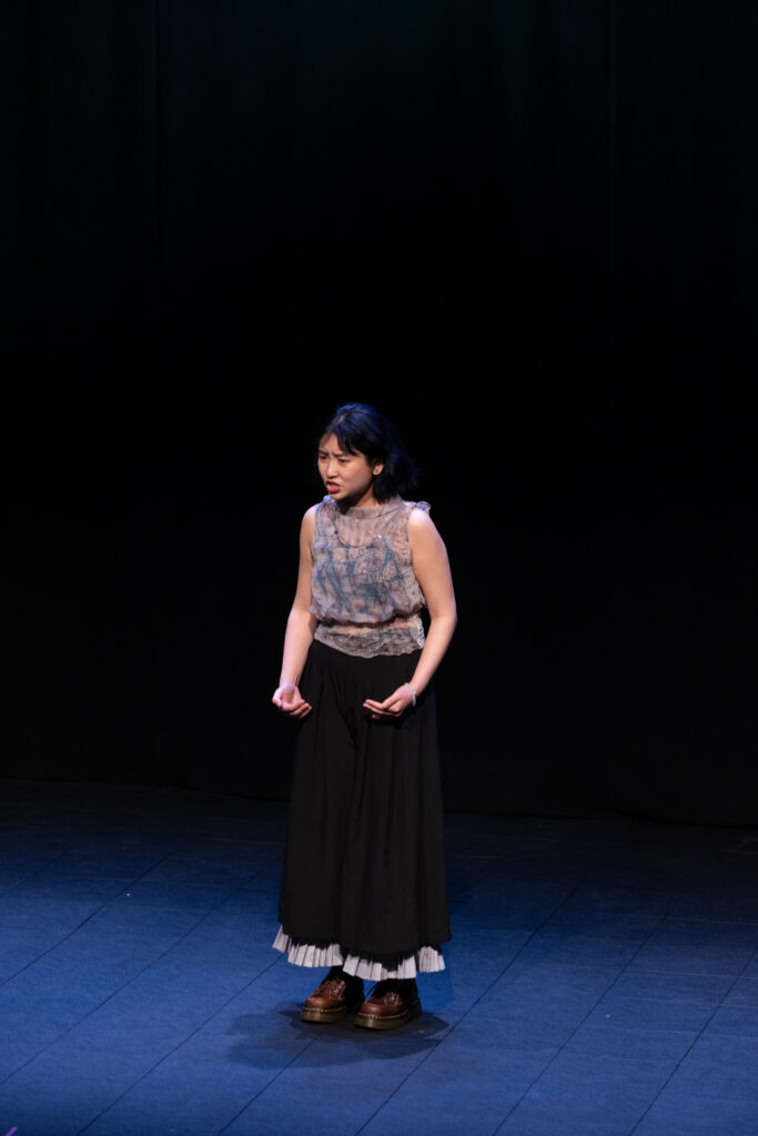 A person performs on stage