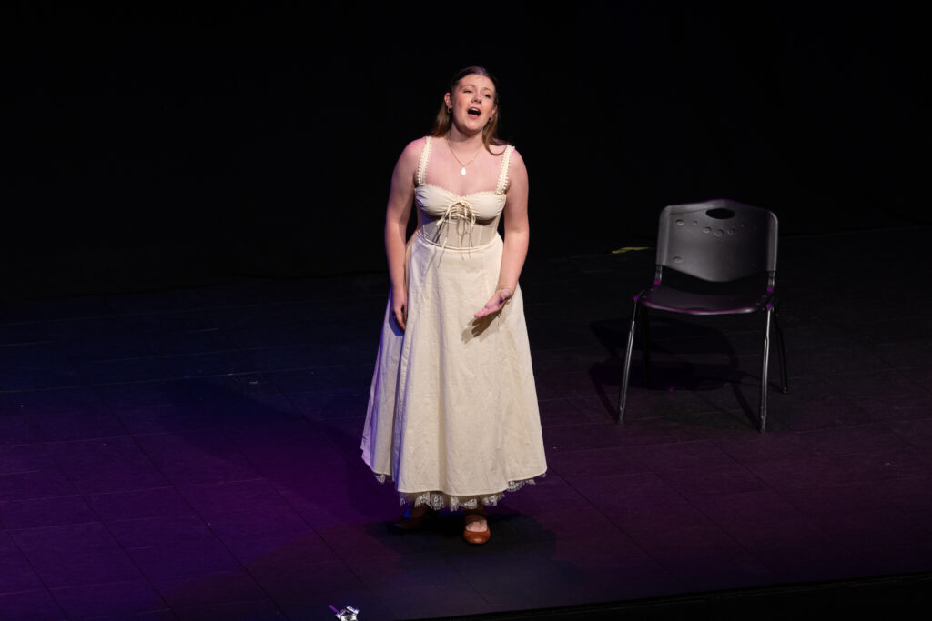 One person sings on stage