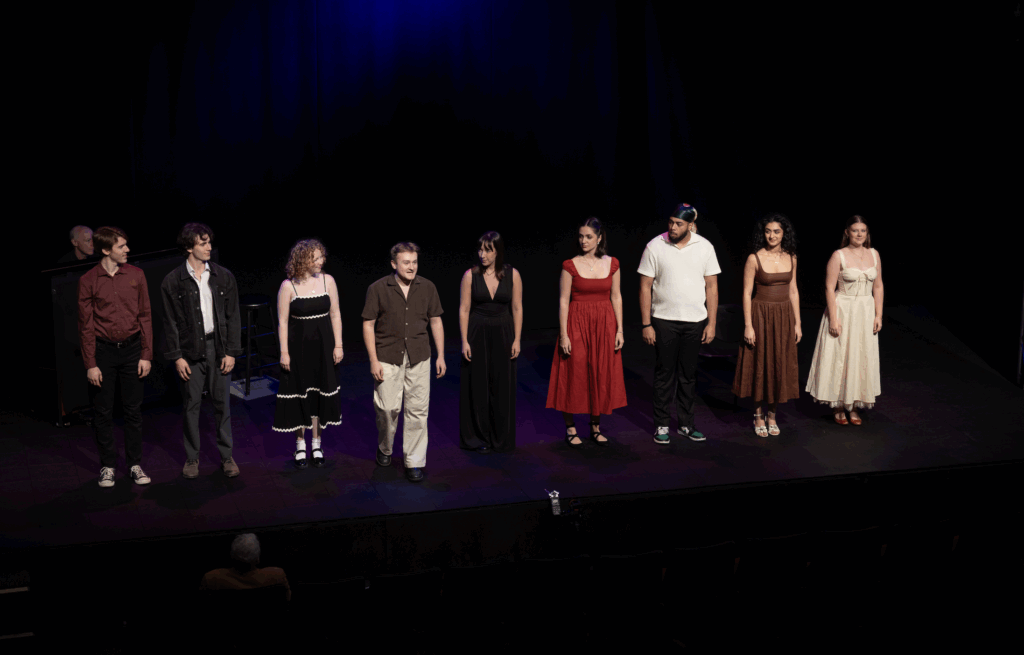 People stand on stage together