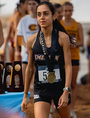 Defne Dadikhi receives her All-American medal