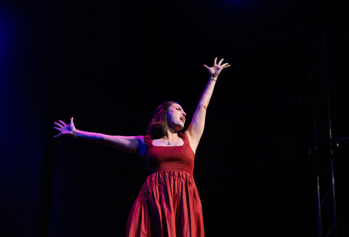 A person sings on stage