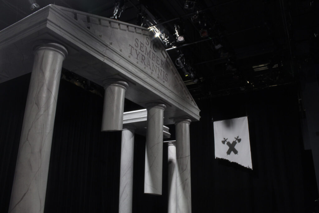 A part of the set that looks like the top of an ancient Roman building with a triangle and Latin words