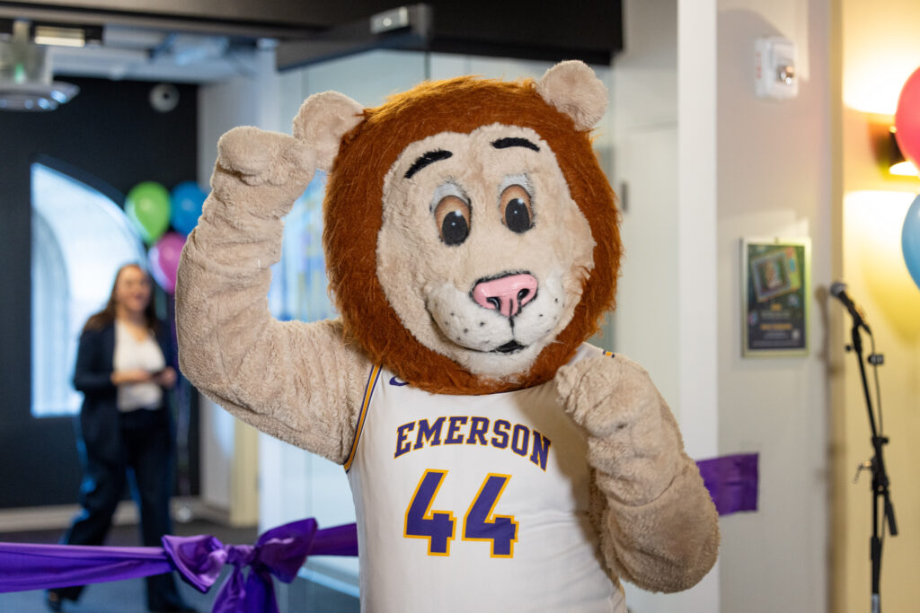 Griff the mascot holds up his paw