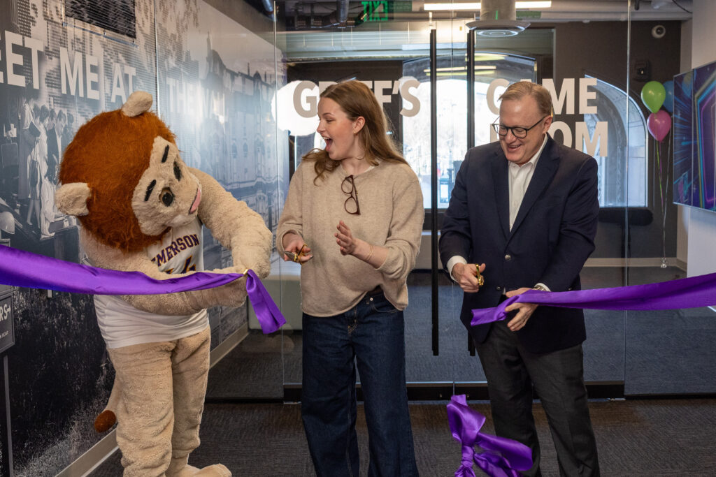 Griff, Georgia Winn, and Jay Bernhardt, cut a purple ribbon.