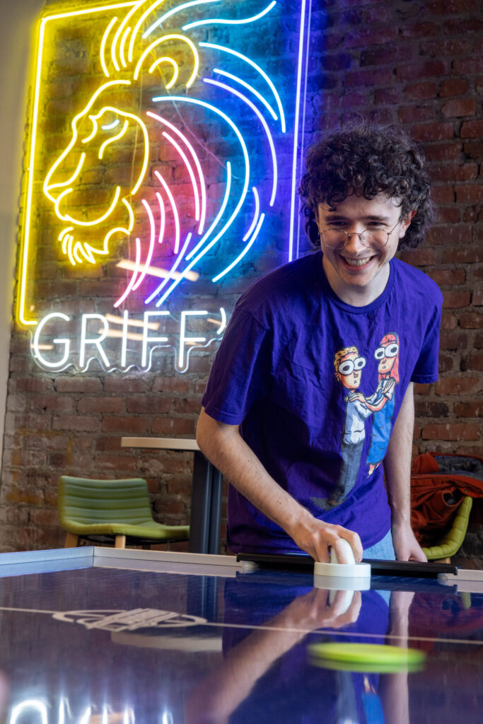 A person plays air hockey