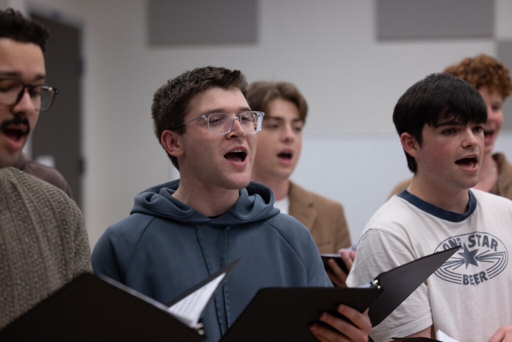 Photo of musical theatre students rehearsing before their performance with actress Sutton Foster