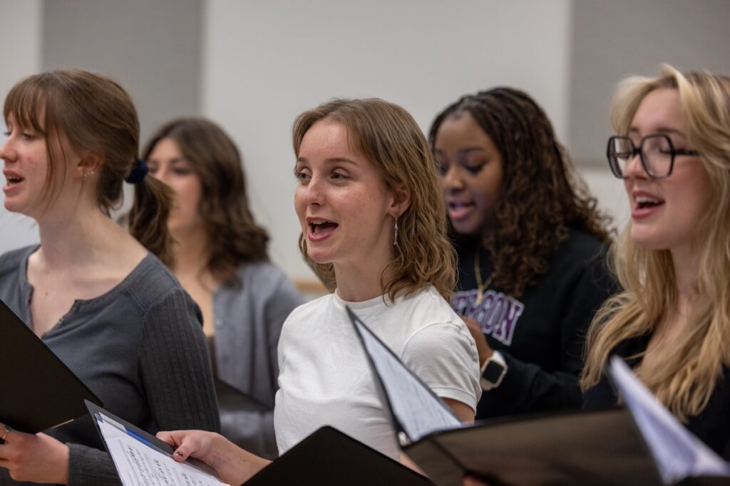 Photo of musical theatre students rehearsing before their performance with actress Sutton Foster