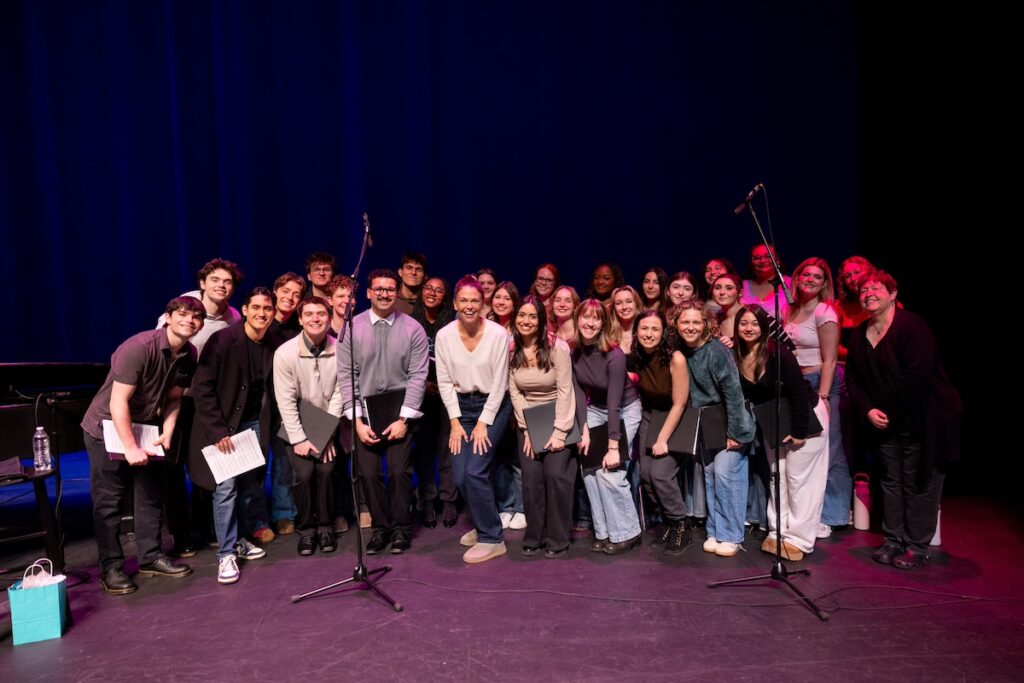 Photo of musical theatre students posing with actress Sutton Foster