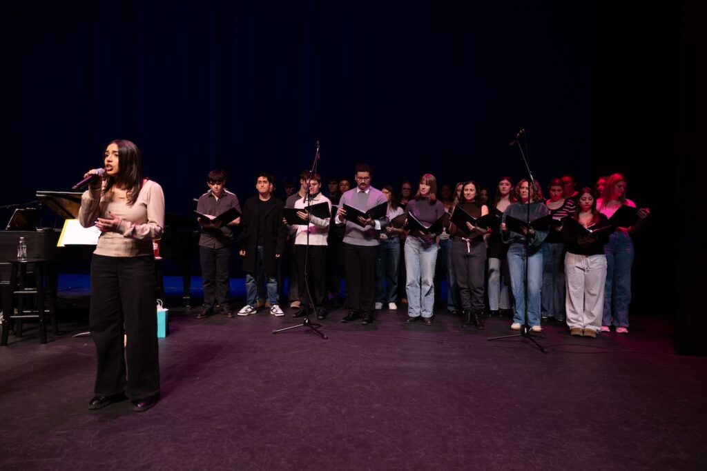 Photo of musical theatre students rehearsing before their performance with actress Sutton Foster