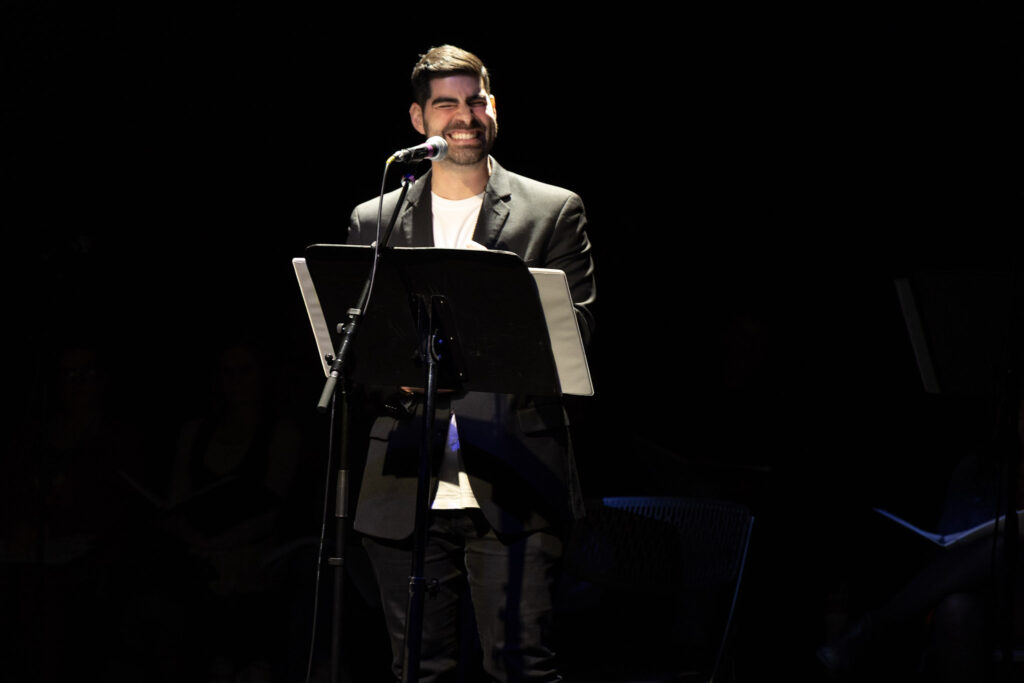 Dru Serkes smiles while performing