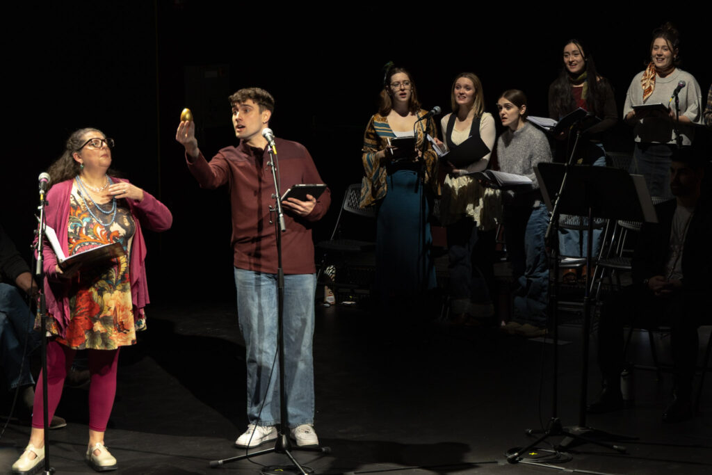 Zeke Manry holds up a pretend egg next to Sabrina Learman