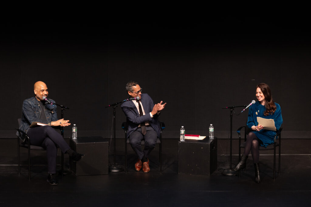 Michael Bobbitt, Roosevelt Montás, and Amber Lee sit in chairs with microphones participating in the panel