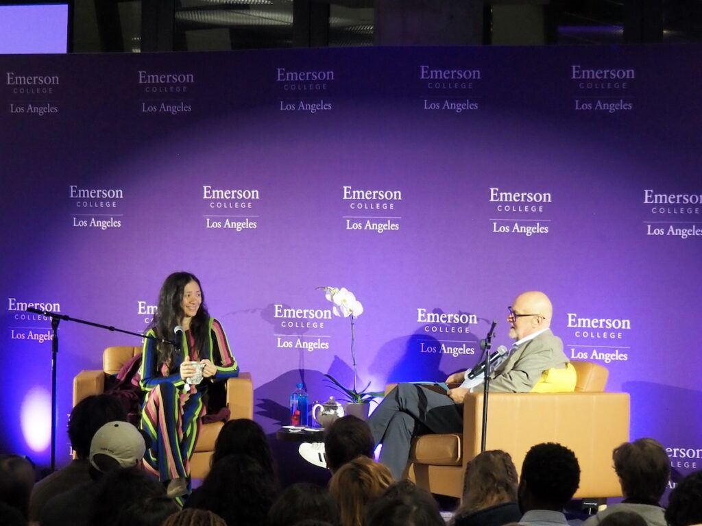 Filmmaker Chloe Zhao and Glenn Meehan '83 sit in chairs in front of an audience