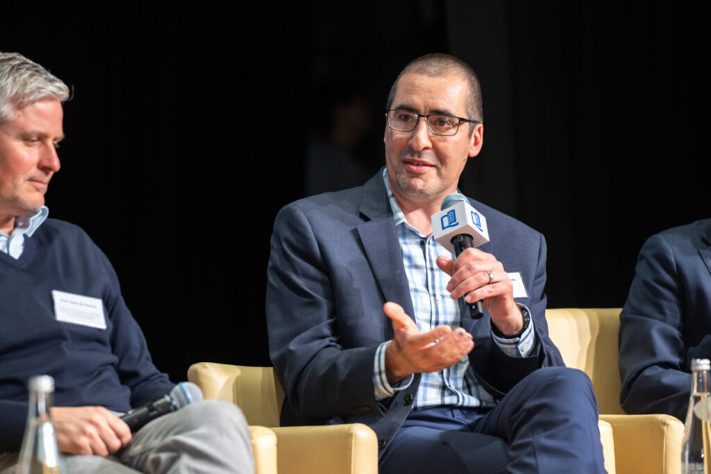 Interim School of Communication Dean Paul Mihailidis speaking at the Hong Kong Baptist University (HKBU)’s AI + COMM International Symposium.