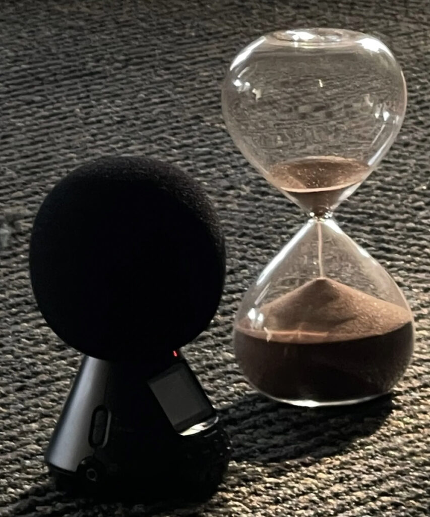 microphone next to an hourglass