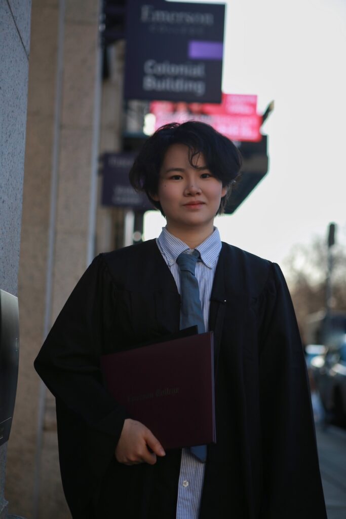 Photo of Echo Lu wearing  commencement regalia