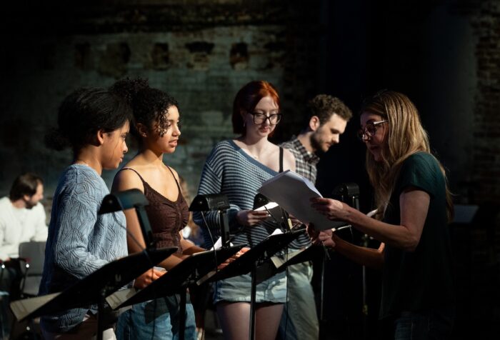 Actress Jane Leeves talks to students during the table reading of script