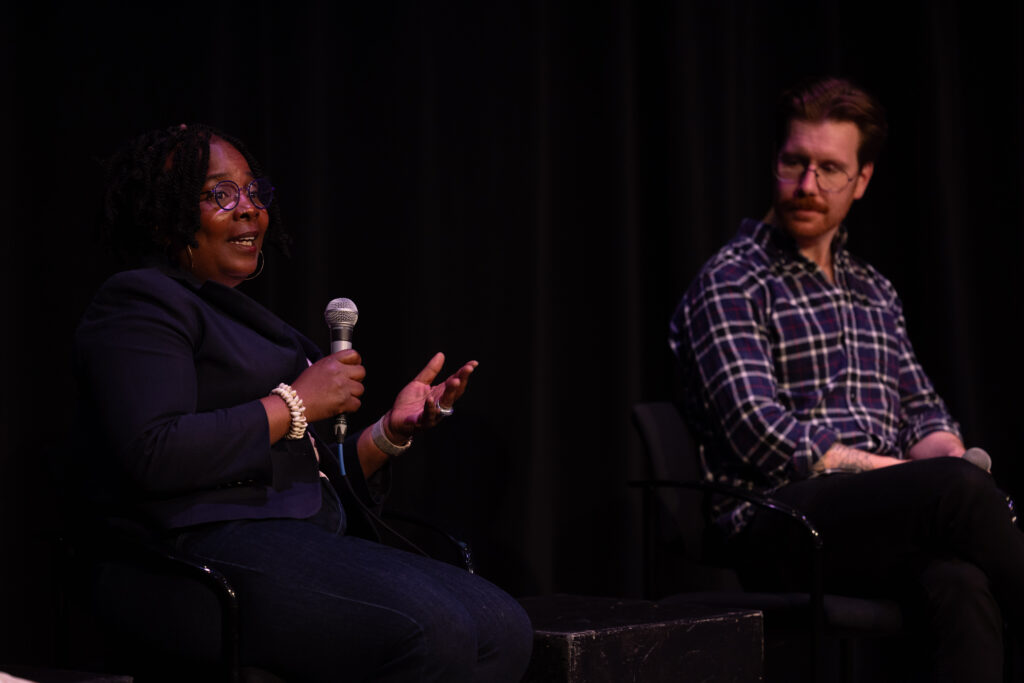 Bridgit Brown speaks while Nicholas Medvescek looks at her