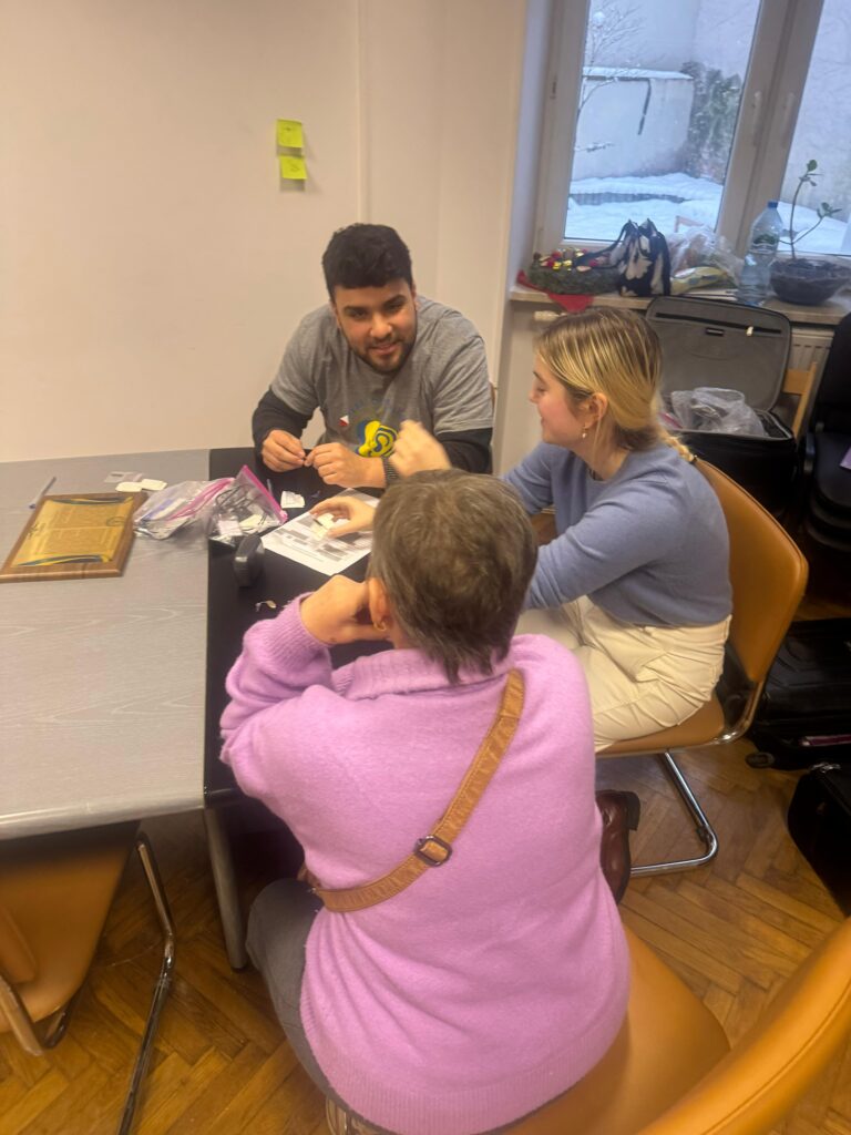 Matt Mascobetto works with two participants in the program