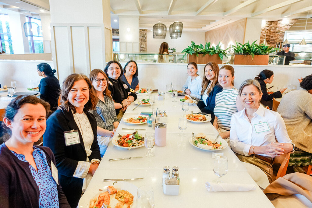 People gather around table at restaurant